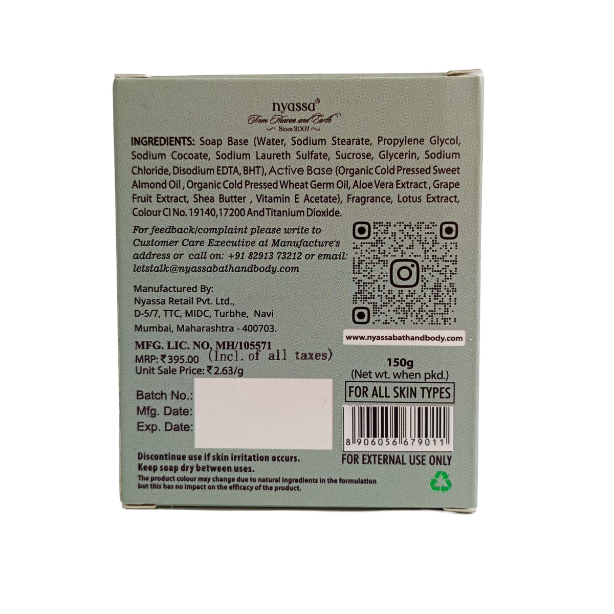 Back side of a rectangular product box showing printed ingredients, a QR code, barcode, and contact details on a light gray background.