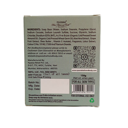 Back side of a rectangular product box showing printed ingredients, a QR code, barcode, and contact details on a light gray background.