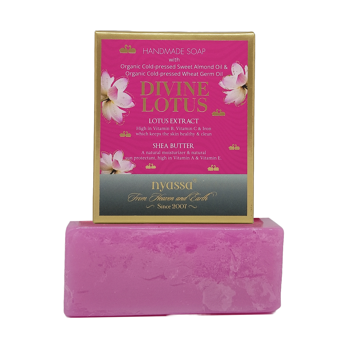 A pink bar of handmade Divine Lotus soap displayed in front of its pink and gold retail box, which features illustrations of lotus flowers and text detailing its ingredients and brand DYASSGA.