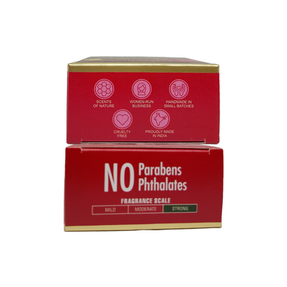 Two red product boxes stacked vertically on a white background. The top box shows pink icons and text including 'Scents of Nature', 'Women Run Businesses', 'Handmade in Small Batches', 'Cruity Free', and 'Proudly Made in India'.