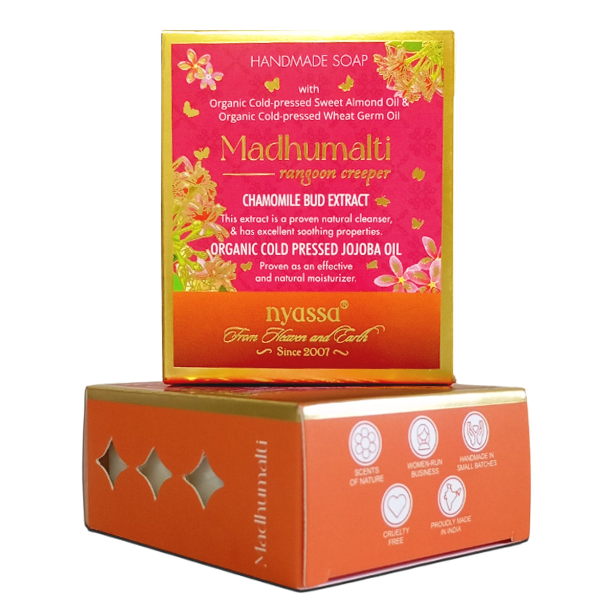 Madhumali handcrafted soap bar displayed in its colorful retail packaging, with the pink and orange box standing upright behind the soap bar on a white background.