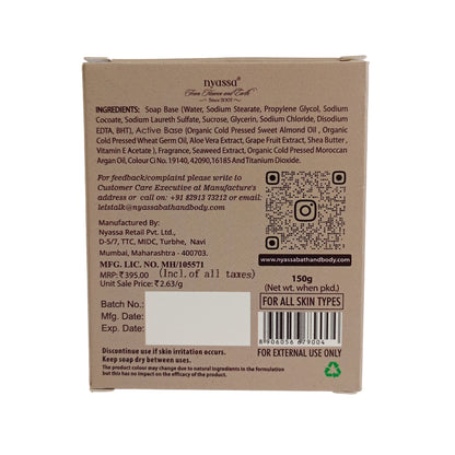 The back of a brown cardboard box for Nyssea Soap Base, showing detailed ingredients, a QR code, a barcode, and usage information in black text.