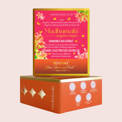 Madhumali Rangoon Creper handmade soap in a pink and orange box with gold foil accents, displayed on top of its orange outer packaging against a light beige background.