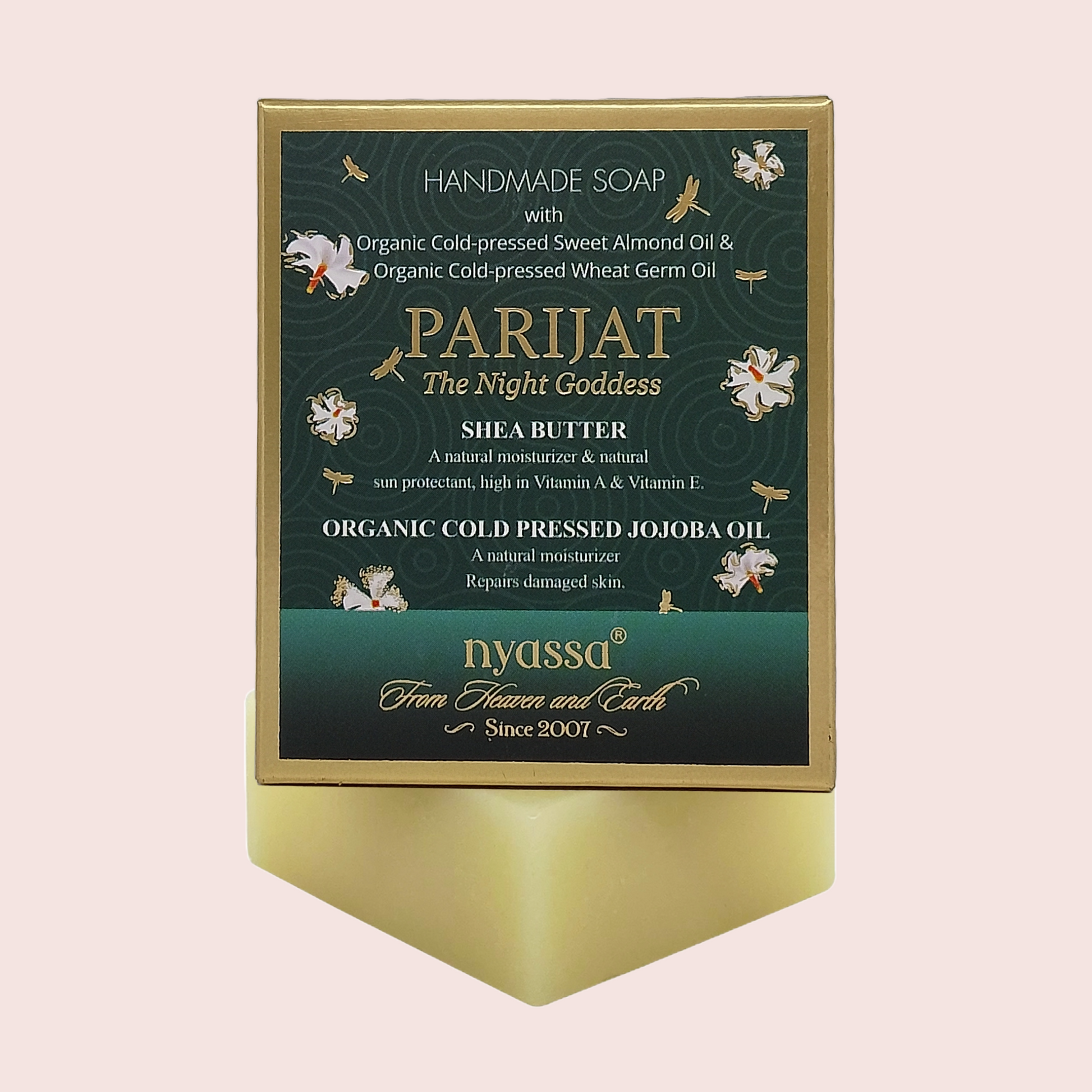 A rectangular bar of soap on a matching display stand, featuring a dark green label with gold and white text and illustrations. The soap itself is a pale yellow-green color, and the brand name 'nyassa' is visible at the bottom of the label.