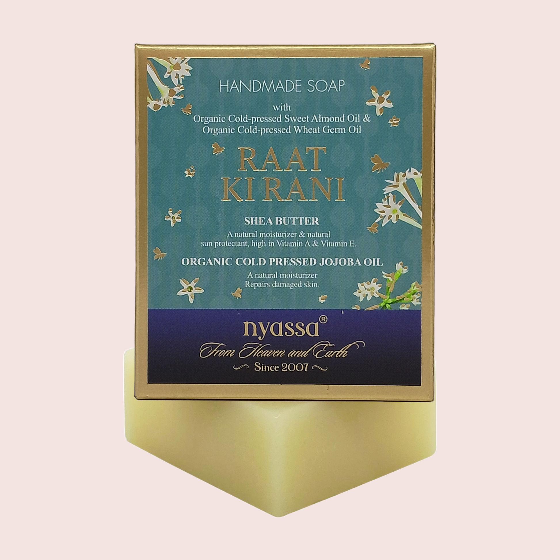 A boxed handmade soap product standing upright on a matching pedestal. The front label reads 'HANDMADE SOAP', 'RAAT KI RANI', and 'Nyssa From Flowers and Earth Since 2001'.