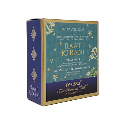 A boxed handmade soap product named Raat Kirani by Nyassa, shown on a plain white background. The box is dark blue with gold trim and a teal front panel featuring floral illustrations and product text.