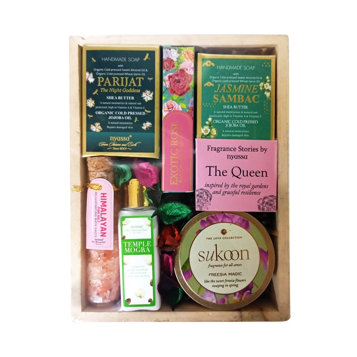 Gourmet gift set with items on a wooden board